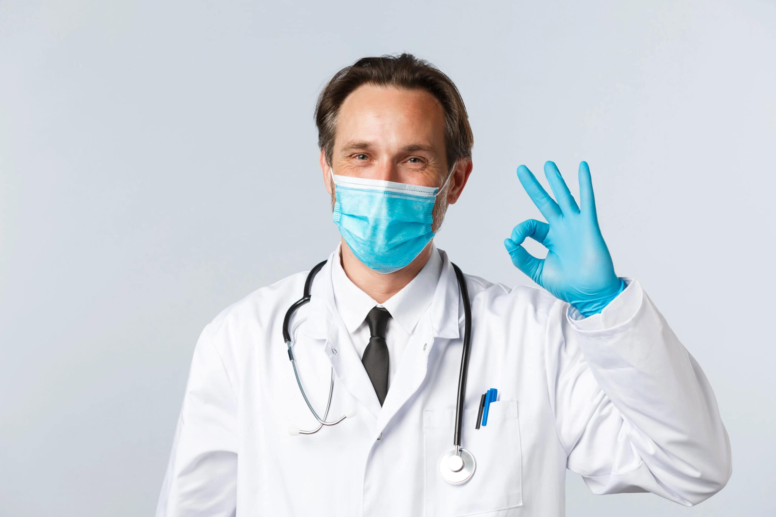 Doctor in medical mask with stethoscope.